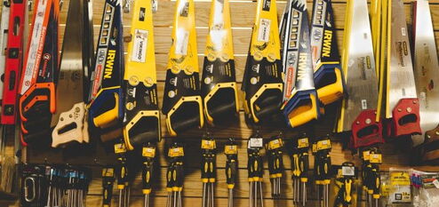 Many tools hanging on a shelf