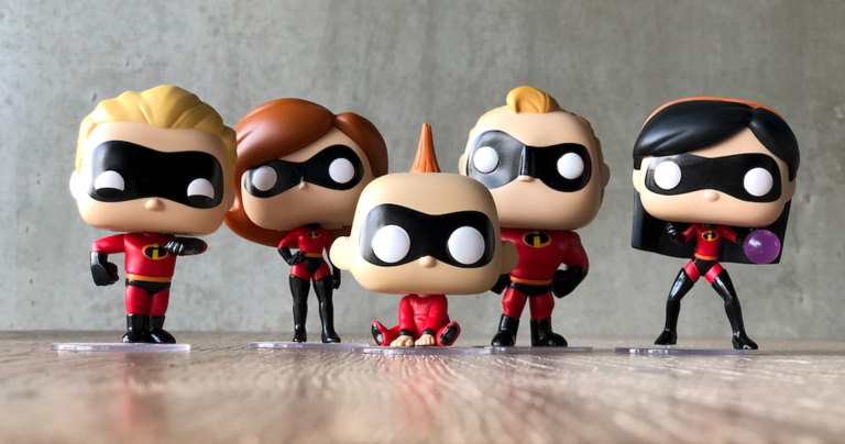 Funko Pop figures of The Incredibles family on a table.