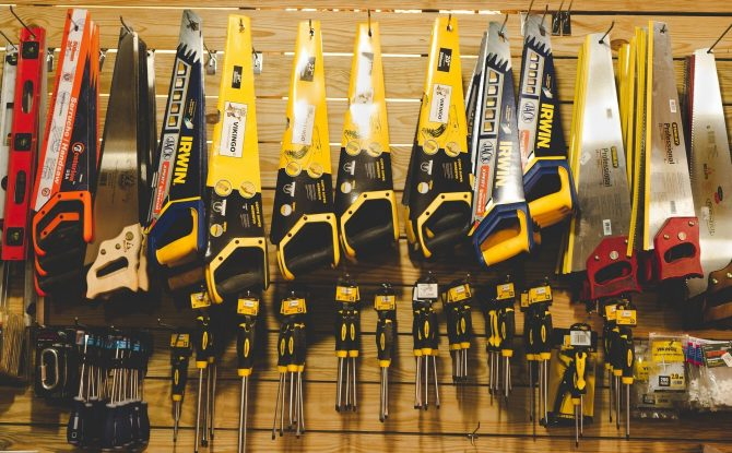 Many tools hanging on a shelf